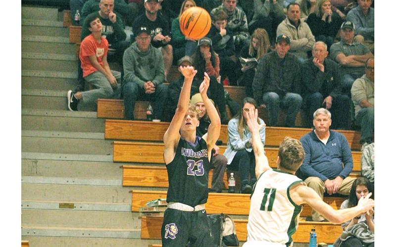 Lumpkin County's Peyton Polk lets a three-pointer fly versus the North Hall Trojans. Polk led the Lumpkin offense with 10 points in the 60-40 loss to the Trojans.
