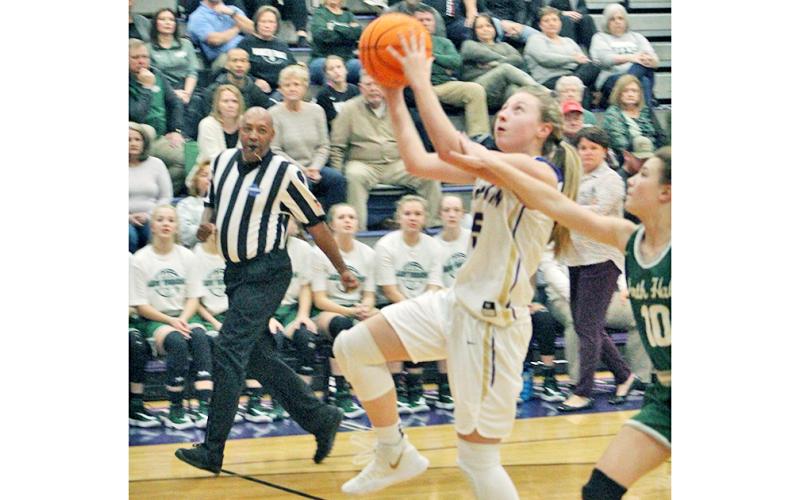 Lexi Pierce flies through the lane for two of her 16 points in Lumpkin’s come-from-behind win over North Hall last week.