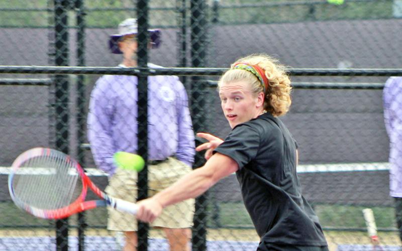 Number one singles player Laken Ferrell returns a volley with a cross court shot. The senior is having a terrific start to the 2020 season.