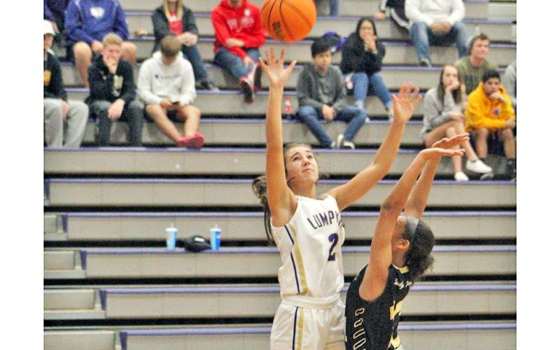 Isabel Davenport absorbs some contact as she scores two points for the Lady Indians basketball team during the 2019-2020 season.