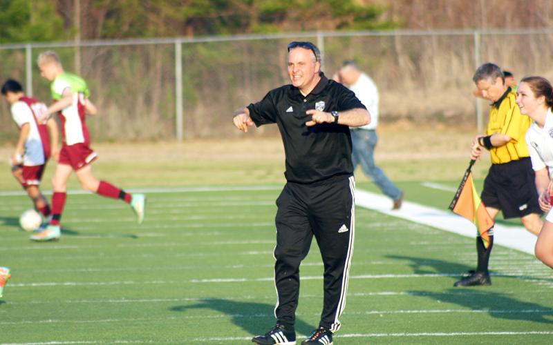 Don Brock cheers on his players after a victory over rival Dawson County. The long-time LCHS girls soccer coach’s career was recognized recently when he was named to Blitz’s Legendary Coaches list.