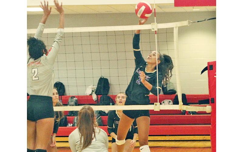 Isabel Davenport gets the upper hand with a deft touch at the net for a Lumpkin point versus Rabun. Davenport has upped her aggressiveness this season and continues, alongside Kiersta Trammell as part of Lumpkin’s setting dynamic duo.