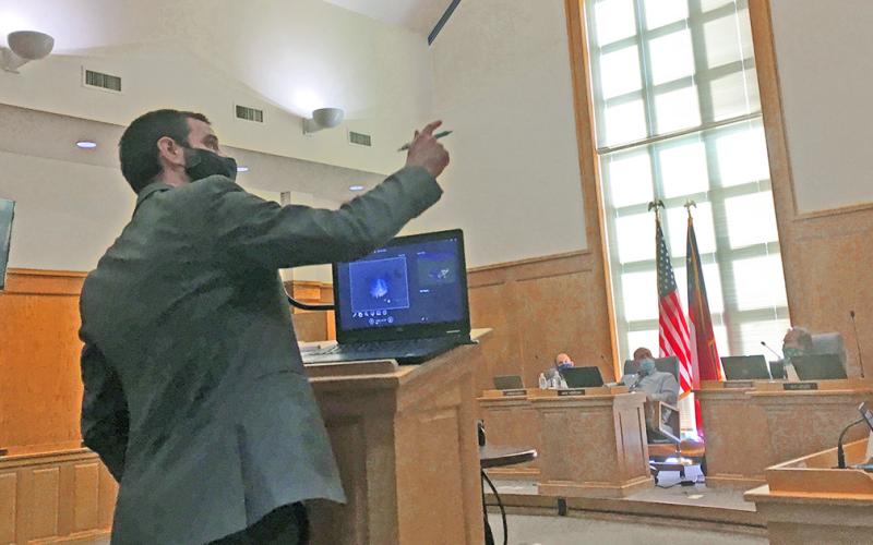 University of North Georgia astronomy assistant professor Dr. Gregory Feiden shares possible solutions to local light pollution during a presentation to the city council.