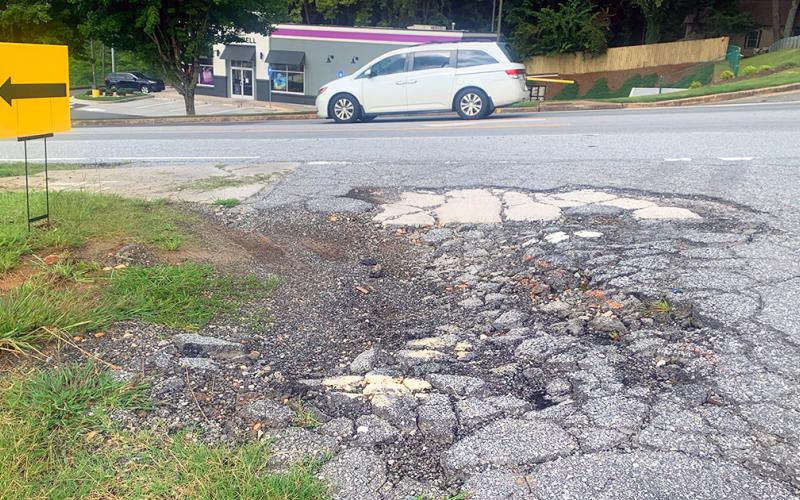 The much-traveled entrance of Mechanicsville Road off Morrison Moore Parkway is crumbling and in need of repairs.