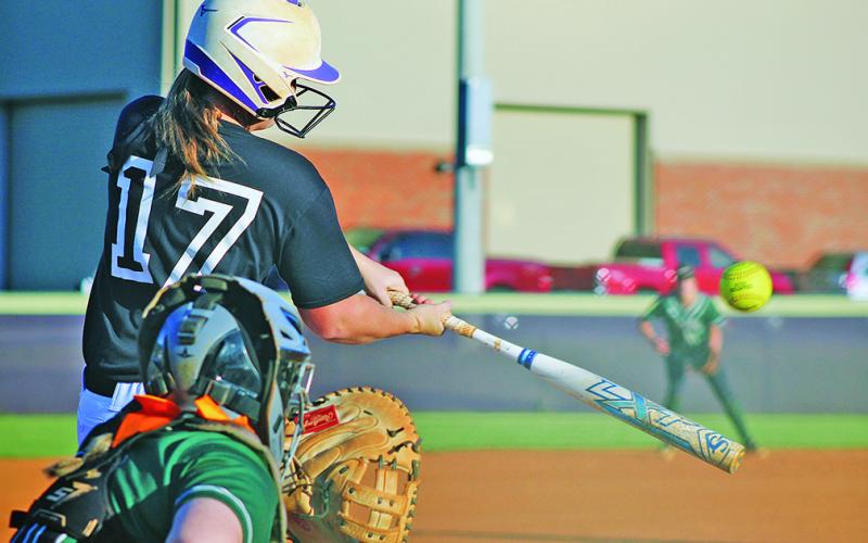 Lumpkin’s sophomore catcher Natalie Shubert smashes a pitch against North Hall during last week’s 3-1 victory.