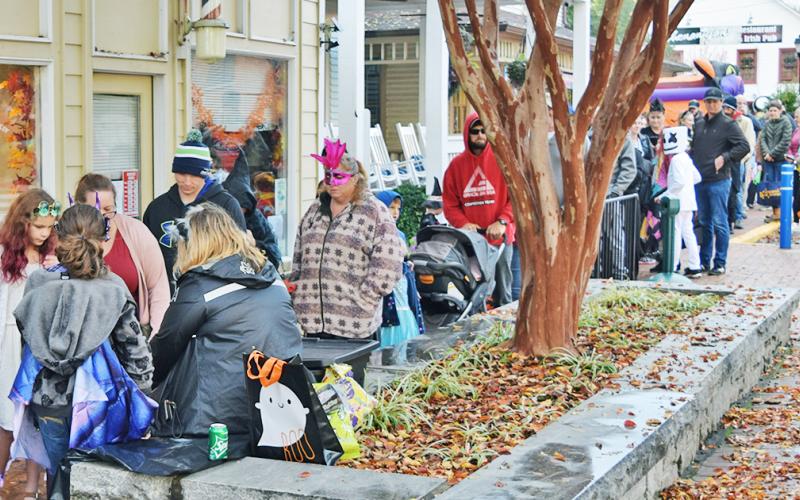 Families line the downtown square during last year's Trick or Treat event.