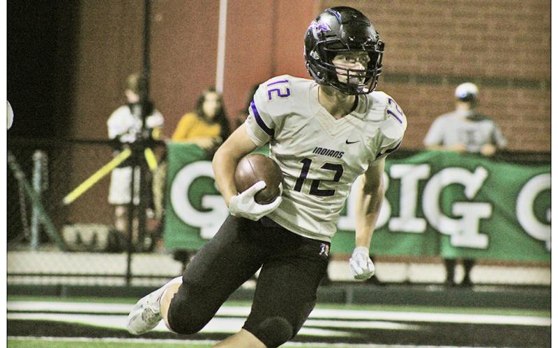 Caleb Norrell carries the ball during a kickoff return against North Hall on Friday. Norrell led the Indians with five receptions for 102 yards and a touchdown as the first Lumpkin receiver to have over 100 yards in one game since Austin Pierce in 2015.