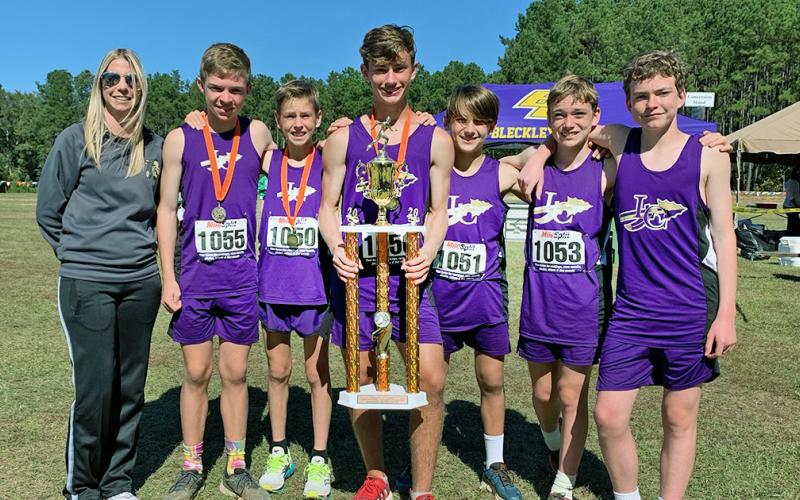 From left: head coach Brooke Flakes, Will Routhier, Sam Edwards, Wyatt Windham, Hagen Glenn, Cooper Marling and Jackson Marling.