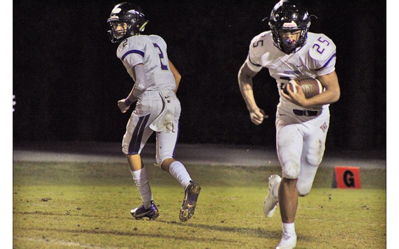 Freshman quarterback Harper Davenport looks for an open reciever downfield in Lumpkin’s game last week.