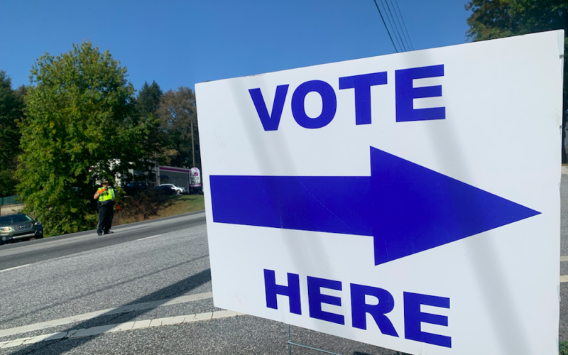 An LCSO deputy stops traffic to wave in voters at the Lumpkin County Parks &amp; Rec. community center on Tuesday.
