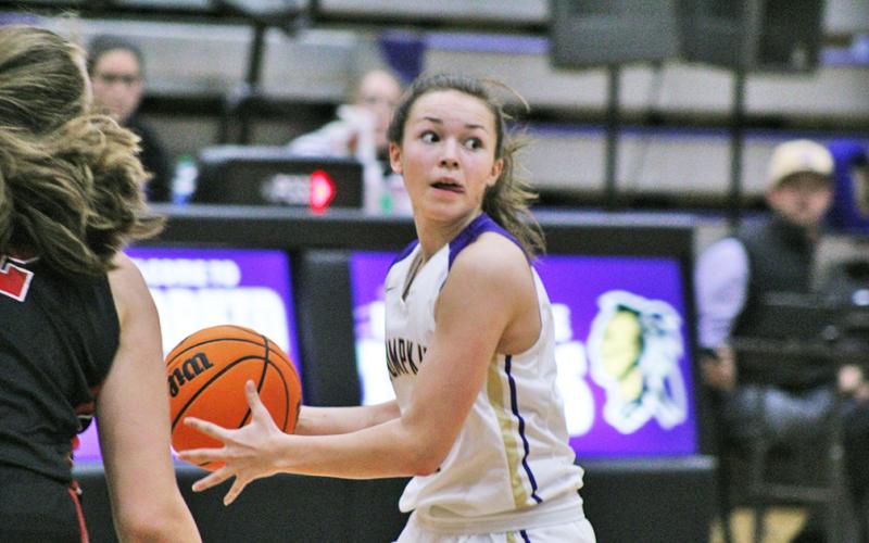 Freshman guard Averie Jones dribbles down the court looking to find an open teammate with a pass during Friday’s loss to Cherokee County. The Cherokee defense kept the Indians under intense pressure all night, making things difficult on the offensive end.