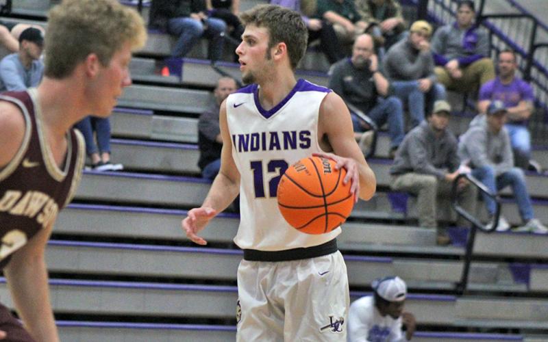 Lumpkin’s Chandler Pulley looks to find an open teammate in Friday’s game against Dawson County.