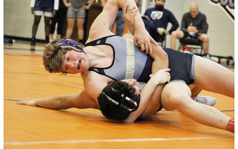Trevor Coryell finishes off his opponent, securing the pin and six points for his team during the GHSA Dual Wrestling State Preliminaries.