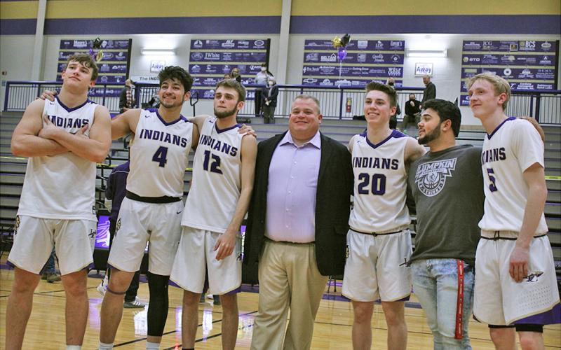 LCHS seniors (from left) Drew Allison, Brian Cunane, Chandler Pulley, head coach Michael Parker, Gus Faulkner, team manager JoJo Allison and Jacob Emmett celebrate a big win on Senior Night. The senior class was sent out with a 68-48 win and now prepare for a chance to go to the state tournament with a win in the first round of the region tournament on Thursday against North Hall.