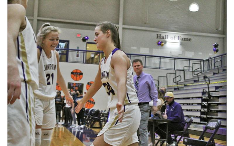 Senior MaKenzie Caldwell is greeted by her teammates as her name is announced with the starting lineup on Senior Night last Tuesday. Caldwell and fellow senior Isabel Davenport represent the first class head coach David Dowse has coached from freshmen to seniors.