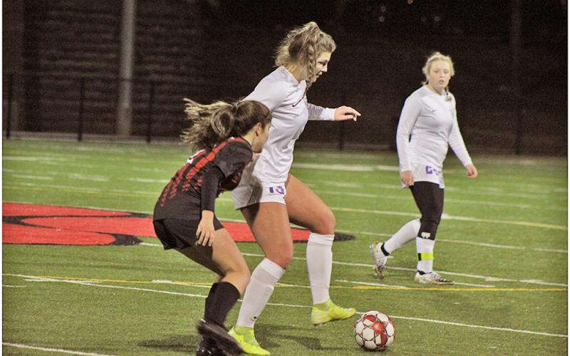 Midfielder Reagan Spivey controls the ball away from her opponent, looking to maintain possession for the Indians.
