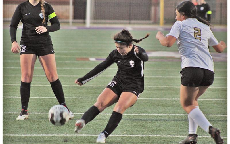 Lumpkin sophomore Nicole Limehouse strikes on goal in Lumpkin’s first action of the season, a scrimmage against East Hall on Thursday.