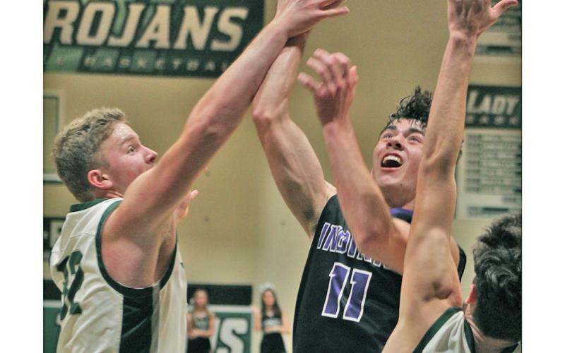 Junior guard Jones Harris puts up a shot in the team’s nail-bitting one-point loss to North Hall on Tuesday. Harris led the team with 19 points despite getting into a bit of foul trouble throughout the game.
