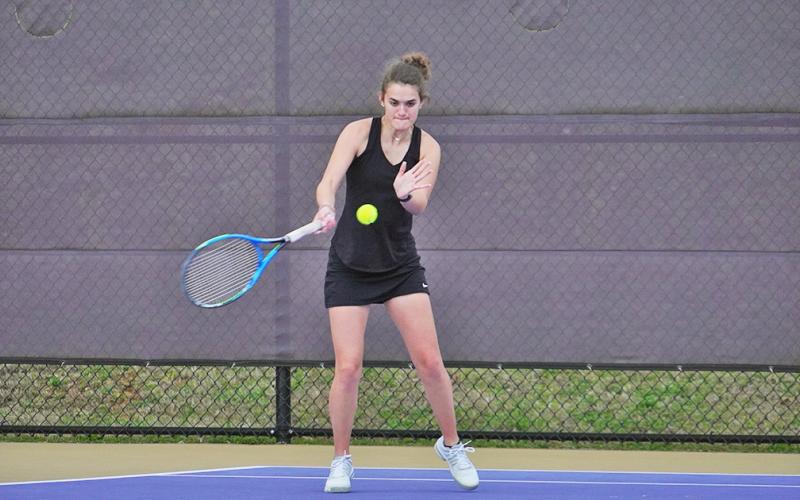 Hannah Davis returns a volley back to her opponent during her match against Gilmer on Thursday. The Indians claimed a 4-1 victory over the Bobcats and continued their Region Matching winning streak heading into the final week of the regular season.