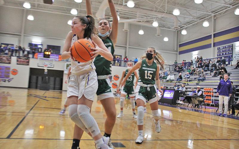 Freshman phenom Averie Jones changes her shot in mid air to duck under the arms of her defender and put the ball back up for a lay in. Jones led the charge, scoring nine of her 27 points in a wild third quarter that saw the Indians increase their lead from six to 26 en route to a Sweet 16 victory.