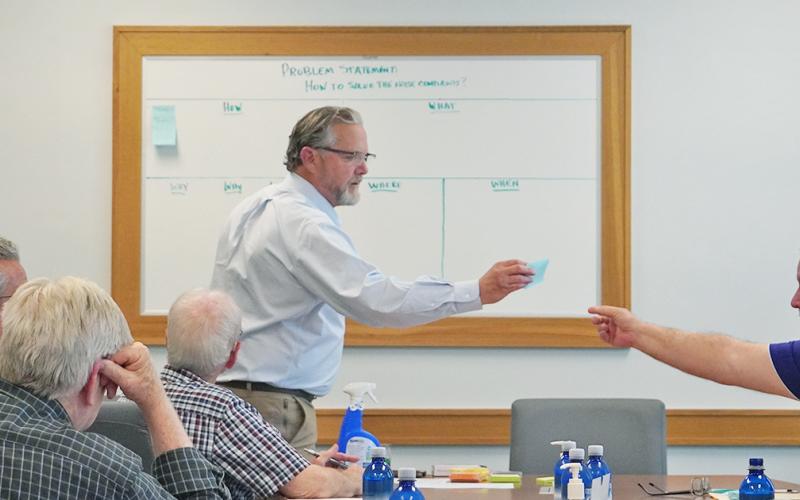 Lumpkin County's Director of Planning Bruce Georgia (left) takes a note from Commissioner Bobby Mayfield during the second Noise Study Committee meeting on Tuesday, April 13. With the mission of coming up with a solution to Lumpkin's noise complaints, the committee brainstormed the idea thoroughly, using the notes to mark each committee member's ideas for the ordinance.