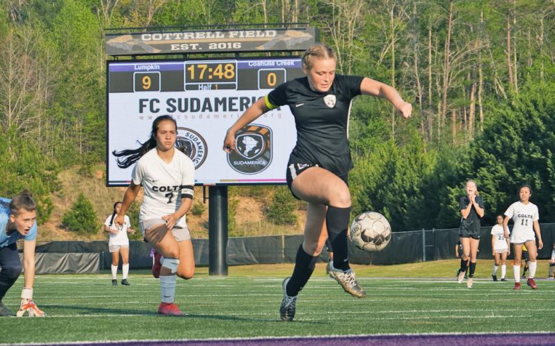 Already past the backline and goal keeper, Cassidy Fuller settles the ball before sending it through the net for the mercy-rule clinching 10th goal of the day as the Indians dismantled Coahulla Creek in their first round playoff game.