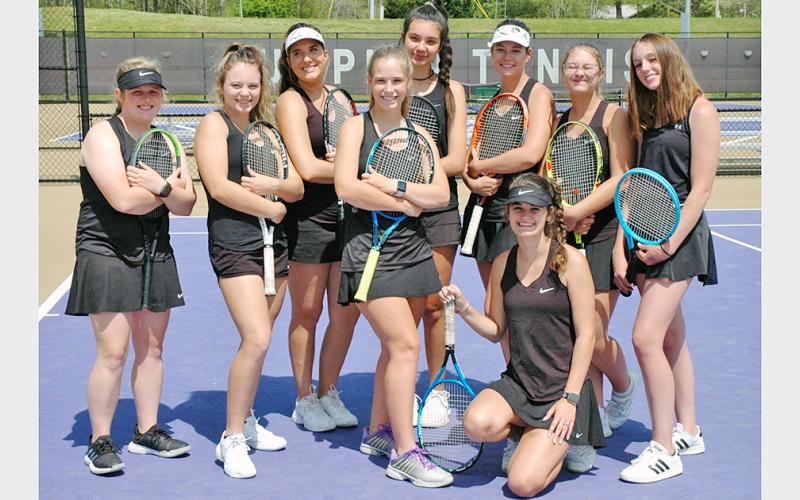 The LCHS Girls Tennis team stopped for a photo before defeating Sonoraville High School in the first round of the state playoffs on Friday.