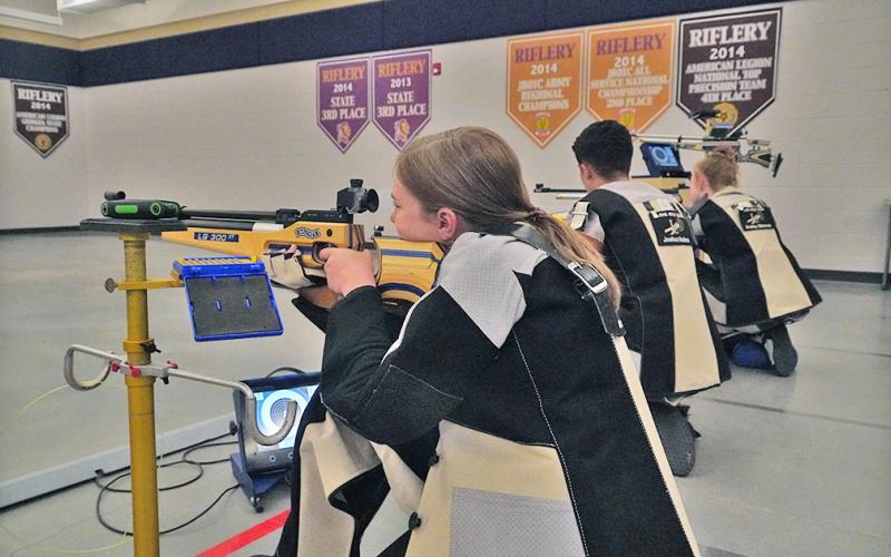 Pictured (from left): Launie Coleman, Joshua Molina and Ansley Gilstrap practice their shooting process before their State Finals appearance. The three, along with Liv Lusky and Maddy Moyer represented the LCHS Rifle team in the GHSA State Rifle Championship where the Indians came away with an eighth place finish.