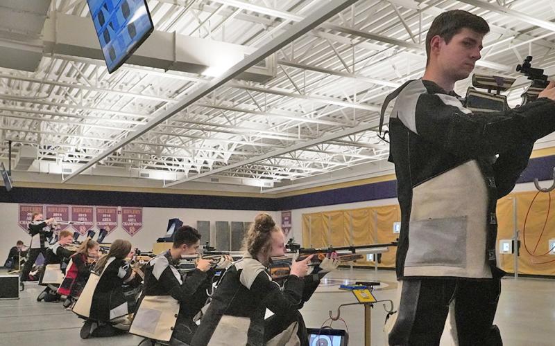 Team Captain Anthony Bauer (right) and the rest of the LCHS Rifle team set their sights on the ultimate prize, a state championship title. The team will be competing at the GHSA Three-Position Air Rifle State Championship on April 24 in Griffin.
