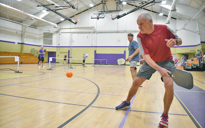 Wes Wessely returns a volley alongside teammate Don Riley during the Yahoola Creek Pickleball tournament last weekend at Parks &amp; Rec.