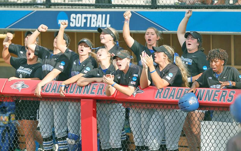 The Nighthawks let out a cheer during the team’s second game at the NCAA Division II Softball Championships in Denver, where the team beat Valdosta State 8-4 to stay alive in the tournament.