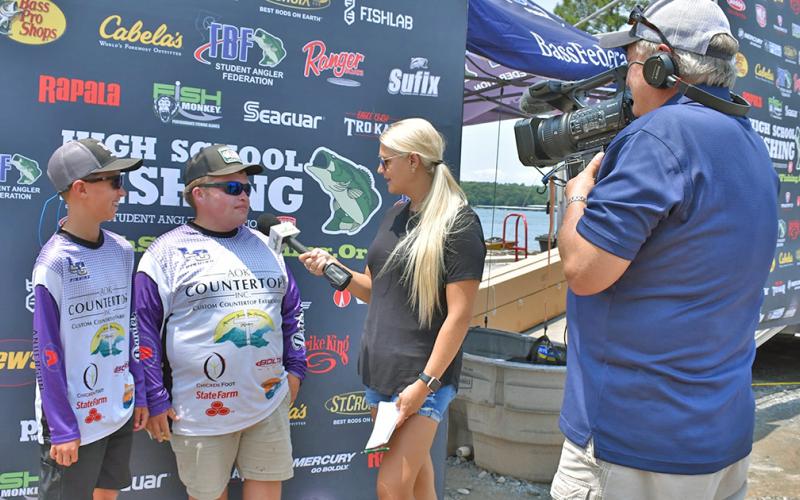 Lumpkin’s Cooper McDonald and Jake Barrett take time for interviews following one of their weigh ins at the High School Fishing National Championships. The tandem represented the LCHS Bass Fishing Team in the National and World Finals, earning a seventh place finish in both events.