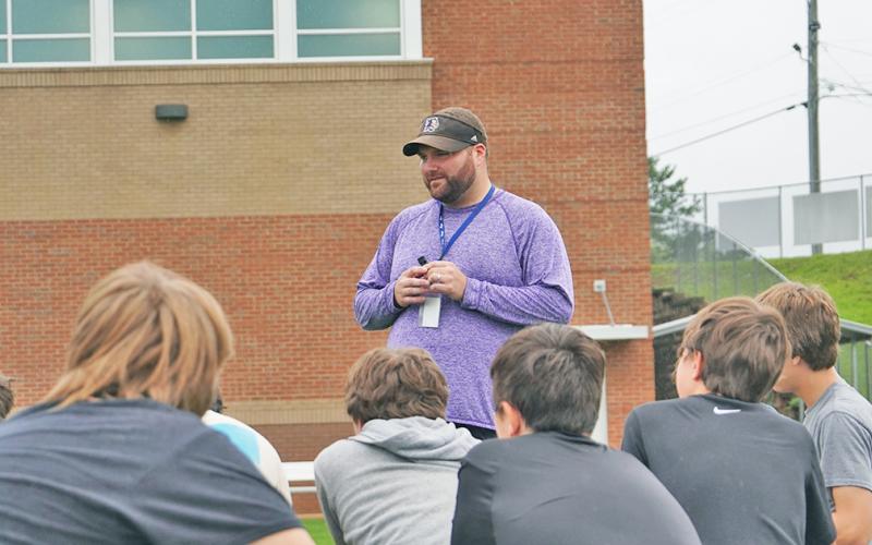 LCMS head coach Hayden Grizzle addresses his team after a recent summer workout. Having worked at both the middle school and high school level, Grizzle said he enjoys coaching the middle school age players the most because he feels he can have a larger positive impact in their lives.