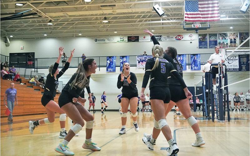 The LCHS Volleyball team celebrates after a massive point in its match versus White County on Thursday. Despite the disappointing start to the season, the team came through with the pressure on to claim its first win of the season against White County, remaining undefeated in region play to begin the year.