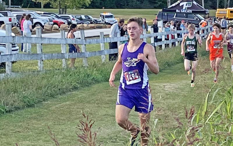 Wyatt Windham pushes on during his run at the Harrier Harvest Meet at Tallulah Falls on Tuesday, Oct. 19, finishing in 10th place and leading the boys to a fourth place overall finish. The girls team also joined the boys with a fourth place finish in the teams’ final tune up before the region meet scheduled for today.