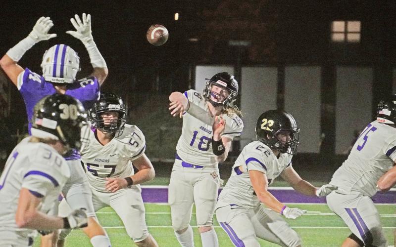 LCHS quarterback Cooper Scott throws a pass while looking through the large hands of the Cherokee Bluff defensive end. The pass ended up in the hands of receiver Cal Faulkner, after being tipped away near its original target, who found himself in the right place at the right time to make the snag.