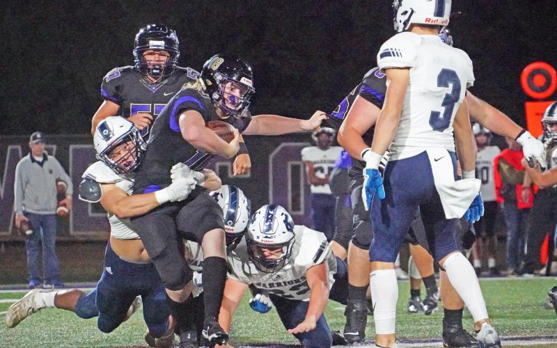 Lumpkin quarterback Cooper Scott is sacked by the White County defensive front after trying to scramble out of trouble during Friday night’s 49-13 loss.