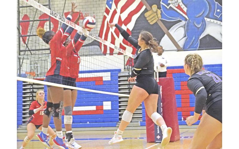 LCHS senior Reagan Spivey attempts to slam the ball past the front wall of Sandy Creek during Lumpkin’s first round state playoff match on Tuesday.