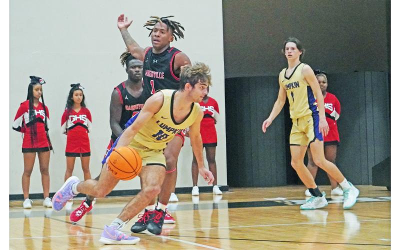 Lumpkin’s Jack Carroll looks to kick the ball back out to an open shooter during the Indians’ scrimmage on Thursday. Head coach Michael Parker said he expects big things from Carroll in the 2021-22 campaign.