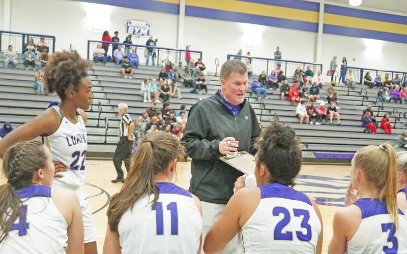 Lumpkin County High School’s now former head coach David Dowse addresses his team during a timeout in its season opener on Thursday, Nov. 18. According to principal Billy Kirk, the plan is to get through this week and into Thanksgiving break before likely announcing an interim coach on Monday, Nov. 29.