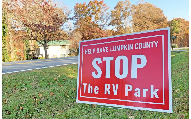 The bright red signs calling for a halt to the proposed RV park have become a familiar sight on the north end of the county.