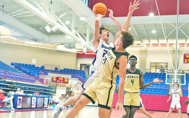 Preston Cox goes up for a tough shot in the post during the Indians’ game against TL Hanna during Day 3 of the Jackson EMC Tip Off Classic.