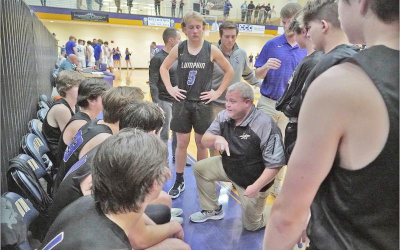 Head coach Michael Parker draws up a play late in Lumpkin’s close loss at Union County on Thursday. The Indians had a chance to tie with 0.5 seconds left, yet were unable to convert the needed basket, falling 55-53.