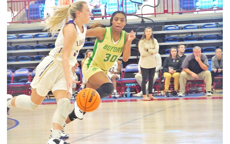 Lexi Pierce presses up the court with the ball in an attempt to open things up against Buford’s full court press during the Indians’ Day 2 game against the Wolves.