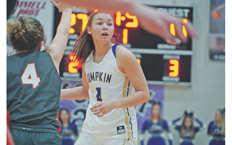 Averie Jones looks to her left for an open teammate in Lumpkin’s game against East Forsyth on Tuesday. Jones dropped 34, including 21 in the first half, to lead the Indians in the team’s first region win of the season.
