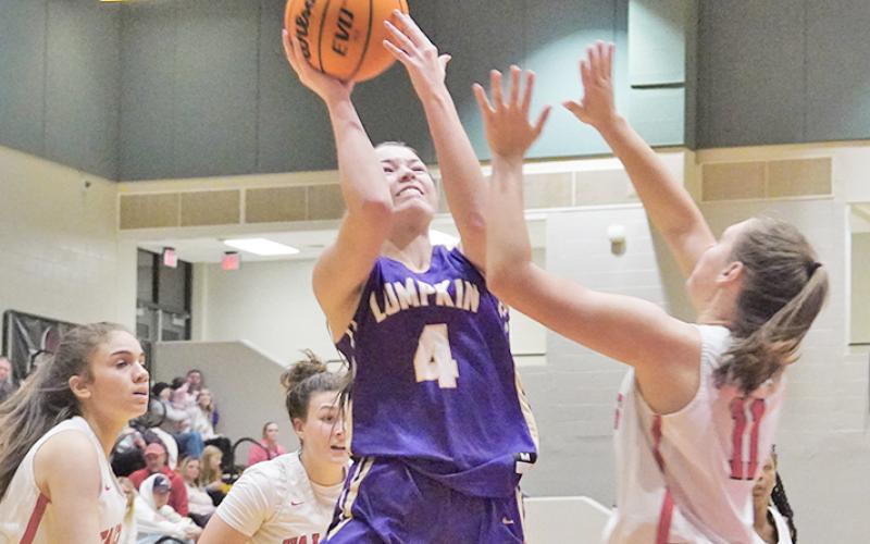 Sophomore Averie Jones puts up a tough shot while under pressure during the Indians 62-24 win. Jones had 16 points in the game to help lead the Indians.