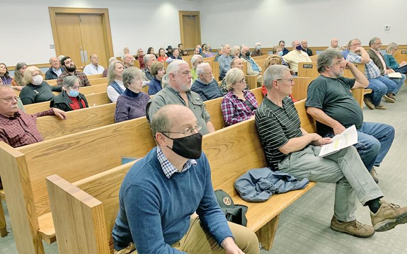 Before lining up at the podium, meeting attendees listened intently to the county commissioners discuss land use in Lumpkin.