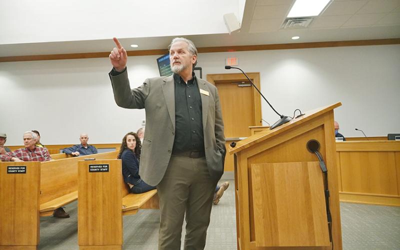 Lumpkin County Planning Director Bruce Georgia points to posters spread throughout the boardroom showing different aspects of the developing land use plans with sections for citizens to write their comments alongside for consideration.