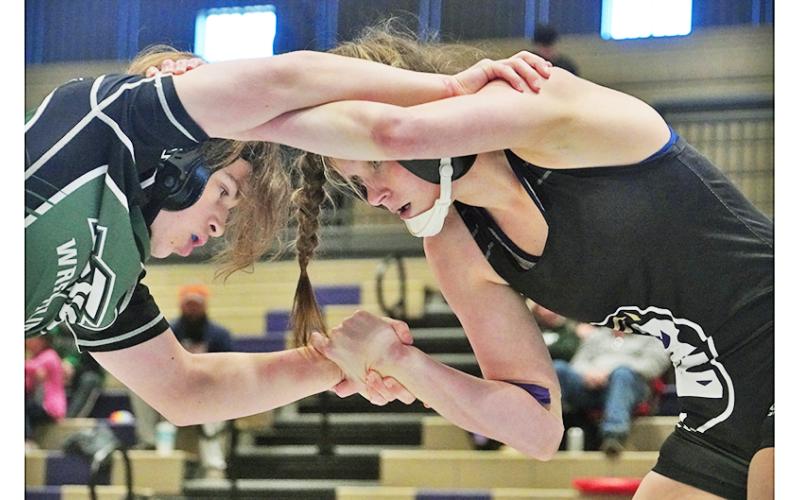 Senior Chloe Carver eyes her opponent before eventually pinning him to seal the win and third place finish in the region for the Indians. Carver made quick work of her opponent, getting the first round pin and earning the maximum amount of points for her team, which needed it to edge out the Trojans, 39-37.