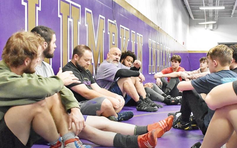 Lumpkin head coach Sean Hage addresses wrestlers in the team’s final practice before the Murray County Invitational.